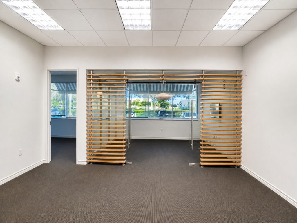Glass-enclosed conference room in Suite H-113